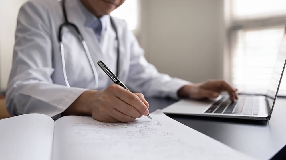 Sleep and Obesity Medicine Blog — physician writing clinical notes at a laptop.