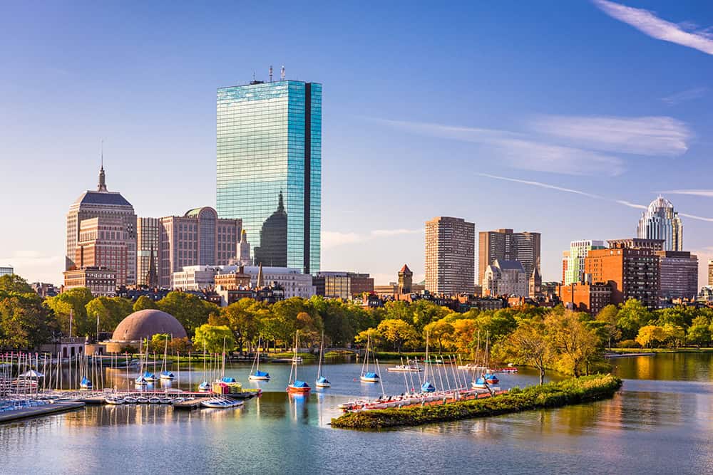 Sleep and Obesity Telemedicine in Massachusetts — Boston skyline over the Charles River with sailboats.