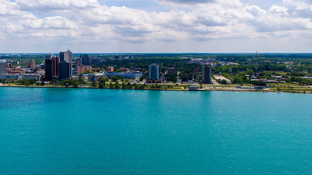 Sleep and Obesity Telemedicine in Michigan — aerial view of the Detroit riverfront skyline.